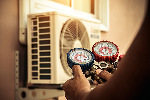 Professional Air Conditioning Service technician working in Plattsburg, MO